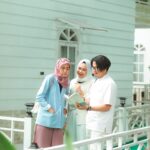 Ufficio postale con persone che effettuano il cambio di residenza per evitare l'IMU sulla seconda casa.